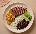 Rio - grilled grass-fed steak with cilantro-lime rice, charred pineapple, and black beans
