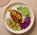 Baja Blaze Chicken Bowl - garlic-lime chipotle chicken over rice with zucchini, purple cabbage, and mango pico