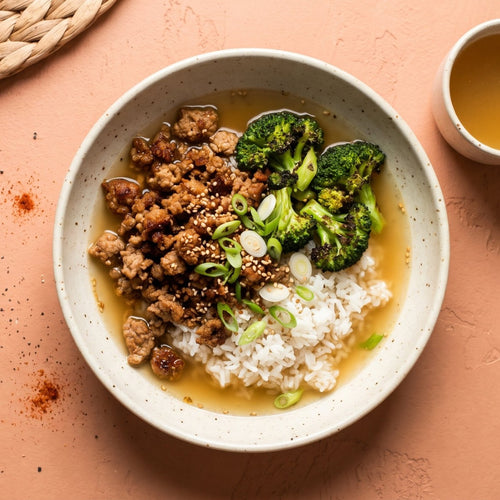 Broth Mode — crispy ground turkey over white rice with charred broccoli, scallion and sesame in a savory bone broth, with a cup of broth alongside