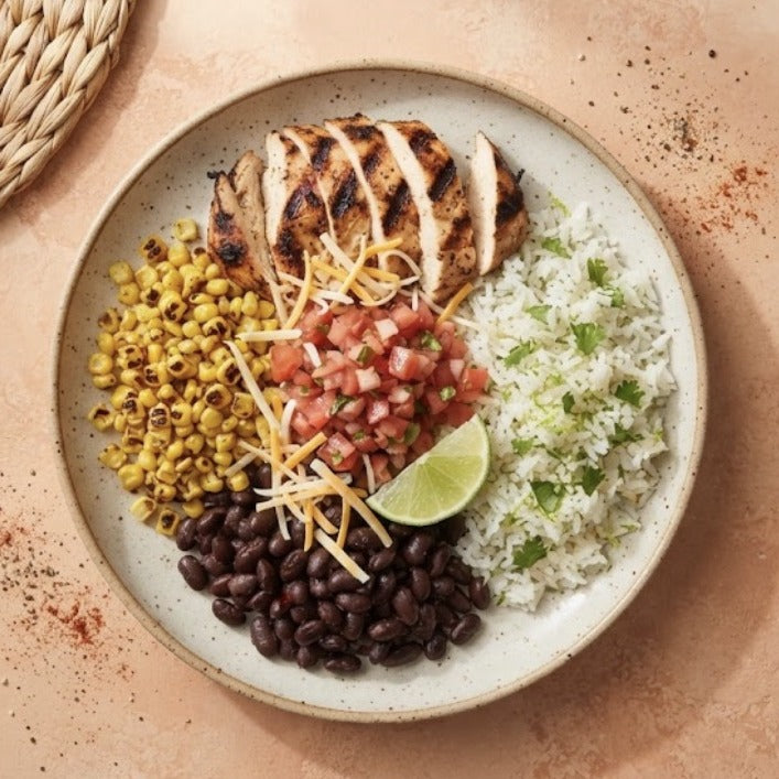 Burrito Bowl (Chicken) — sliced grilled chicken breast with cilantro-lime rice, black beans, charred corn, pico de gallo and shredded cheese