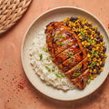 Honey Chipotle Chicken — chipotle honey glazed halal chicken breast over jasmine rice with blistered corn and black beans