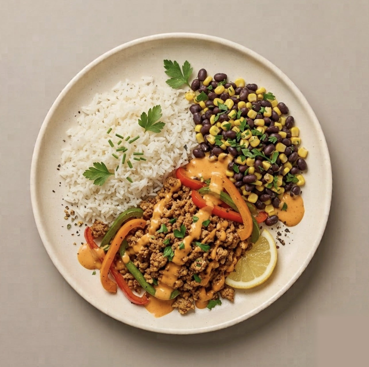 Tulum — seasoned ground turkey with jasmine rice, black beans and corn, sautéed bell peppers, and Boom Boom drizzle
